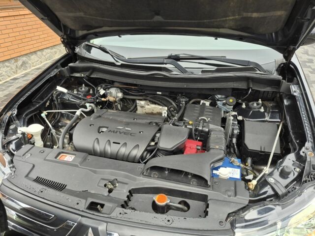 Черный Мицубиси Аутлендер, объемом двигателя 2.4 л и пробегом 211 тыс. км за 12590 $, фото 17 на Automoto.ua