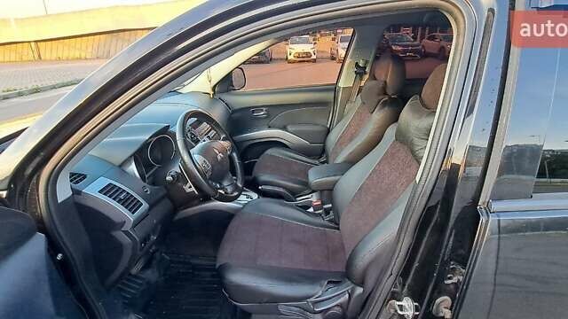 Черный Мицубиси Аутлендер, объемом двигателя 2.36 л и пробегом 285 тыс. км за 11300 $, фото 16 на Automoto.ua