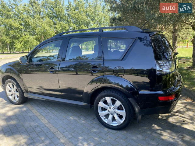 Черный Мицубиси Аутлендер, объемом двигателя 2.36 л и пробегом 155 тыс. км за 9000 $, фото 2 на Automoto.ua