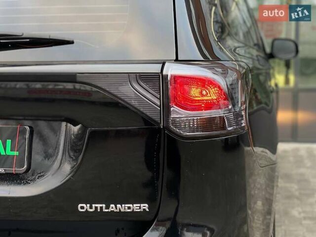 Черный Мицубиси Аутлендер, объемом двигателя 2.36 л и пробегом 212 тыс. км за 12990 $, фото 8 на Automoto.ua