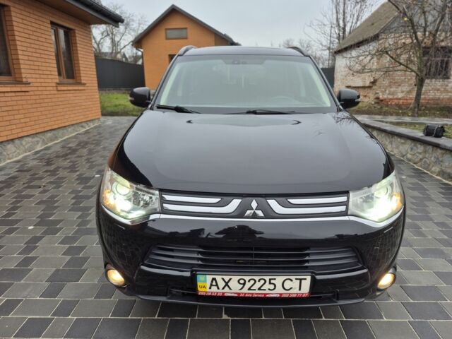 Черный Мицубиси Аутлендер, объемом двигателя 2.4 л и пробегом 211 тыс. км за 12590 $, фото 3 на Automoto.ua