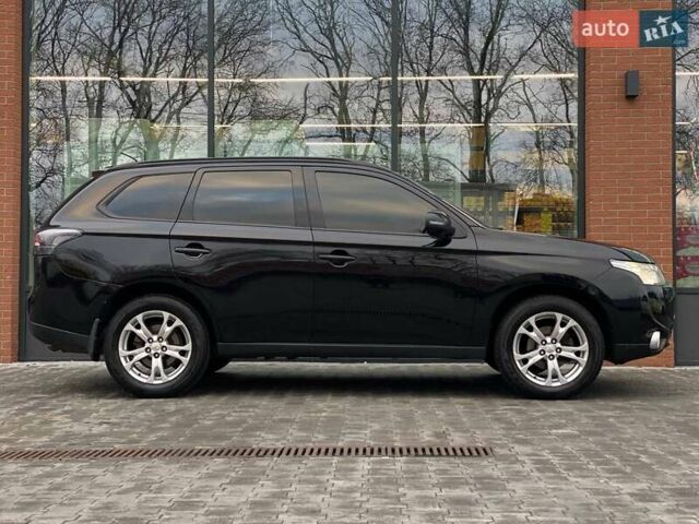 Черный Мицубиси Аутлендер, объемом двигателя 2.36 л и пробегом 212 тыс. км за 12990 $, фото 5 на Automoto.ua