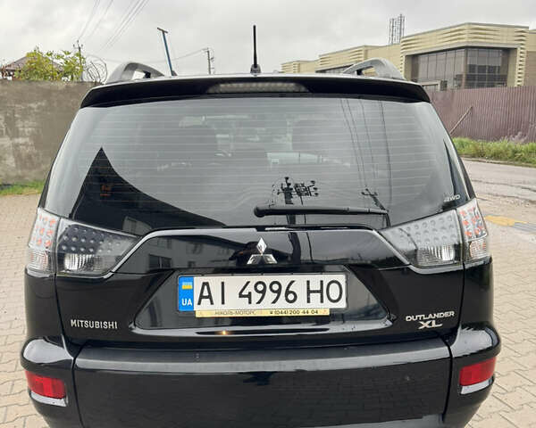 Чорний Міцубісі Аутлендер, об'ємом двигуна 2.36 л та пробігом 96 тис. км за 11700 $, фото 3 на Automoto.ua