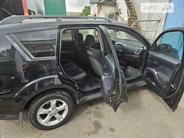 Чорний Міцубісі Аутлендер, об'ємом двигуна 2.36 л та пробігом 164 тис. км за 10800 $, фото 9 на Automoto.ua