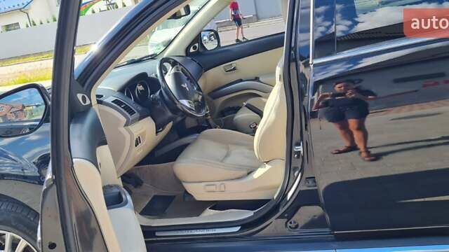 Черный Мицубиси Аутлендер, объемом двигателя 2.27 л и пробегом 195 тыс. км за 10500 $, фото 9 на Automoto.ua