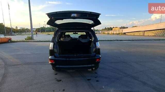 Черный Мицубиси Аутлендер, объемом двигателя 2.36 л и пробегом 285 тыс. км за 11300 $, фото 22 на Automoto.ua