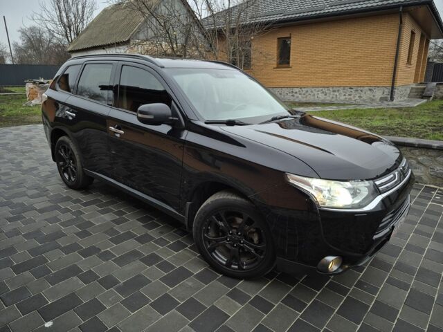 Черный Мицубиси Аутлендер, объемом двигателя 2.4 л и пробегом 211 тыс. км за 12590 $, фото 4 на Automoto.ua