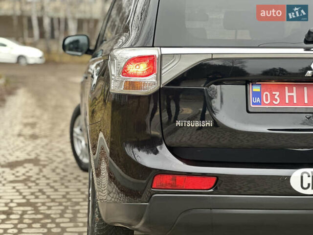 Чорний Міцубісі Аутлендер, об'ємом двигуна 2.2 л та пробігом 176 тис. км за 13500 $, фото 10 на Automoto.ua