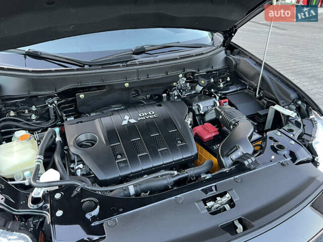 Чорний Міцубісі Аутлендер, об'ємом двигуна 2.3 л та пробігом 124 тис. км за 11999 $, фото 95 на Automoto.ua