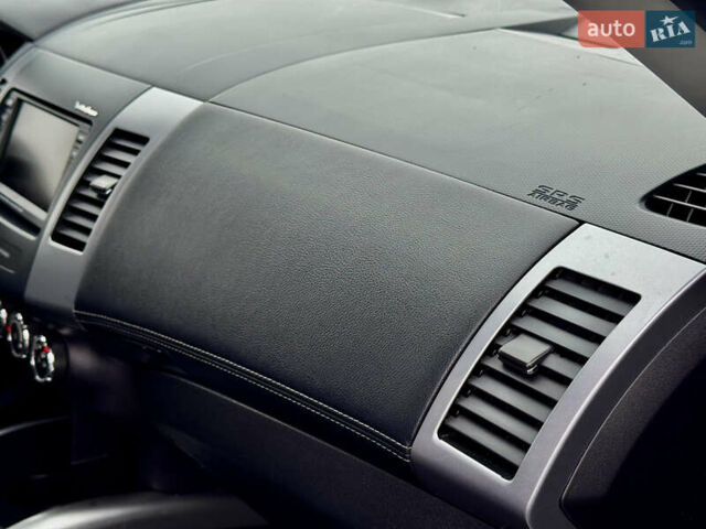 Черный Мицубиси Аутлендер, объемом двигателя 2.2 л и пробегом 215 тыс. км за 11450 $, фото 28 на Automoto.ua