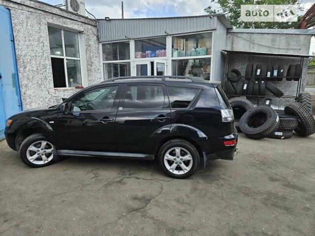 Чорний Міцубісі Аутлендер, об'ємом двигуна 2.36 л та пробігом 164 тис. км за 10800 $, фото 7 на Automoto.ua