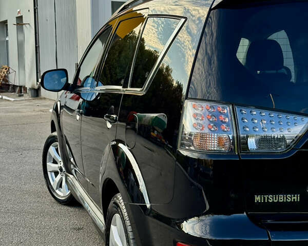 Мицубиси Аутлендер 2012 в Полтаве на Automoto.ua Черный Мицубиси Аутлендер, объемом двигателя 2.3 л и пробегом 194 тыс. км за 11450 $, фото 11 на Automoto.ua
