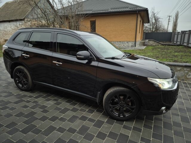 Черный Мицубиси Аутлендер, объемом двигателя 2.4 л и пробегом 211 тыс. км за 12590 $, фото 5 на Automoto.ua