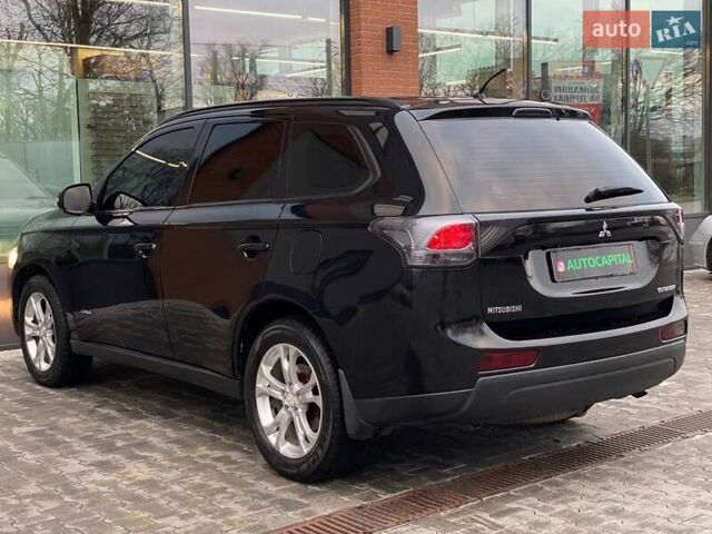 Черный Мицубиси Аутлендер, объемом двигателя 2.36 л и пробегом 212 тыс. км за 12990 $, фото 6 на Automoto.ua
