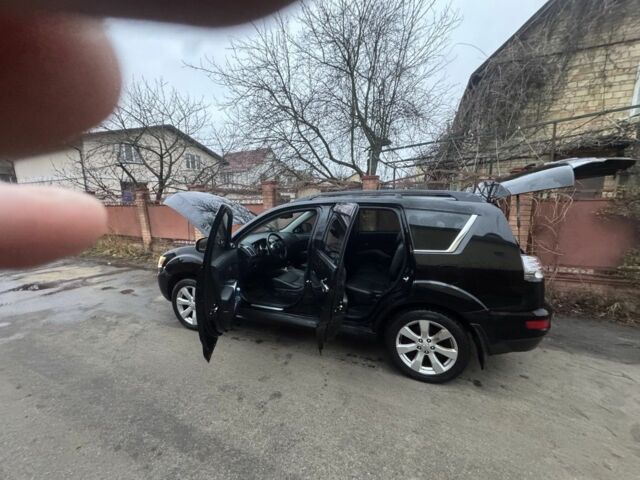 Черный Мицубиси Аутлендер, объемом двигателя 2.4 л и пробегом 136 тыс. км за 14500 $, фото 3 на Automoto.ua