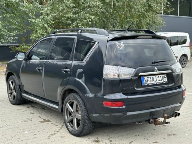 Черный Мицубиси Аутлендер, объемом двигателя 2 л и пробегом 250 тыс. км за 4850 $, фото 2 на Automoto.ua