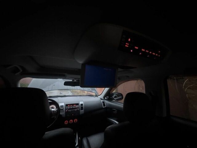 Черный Мицубиси Аутлендер, объемом двигателя 2.4 л и пробегом 136 тыс. км за 14500 $, фото 2 на Automoto.ua