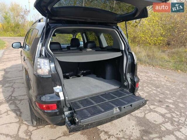 Черный Мицубиси Аутлендер, объемом двигателя 2.2 л и пробегом 218 тыс. км за 11800 $, фото 2 на Automoto.ua