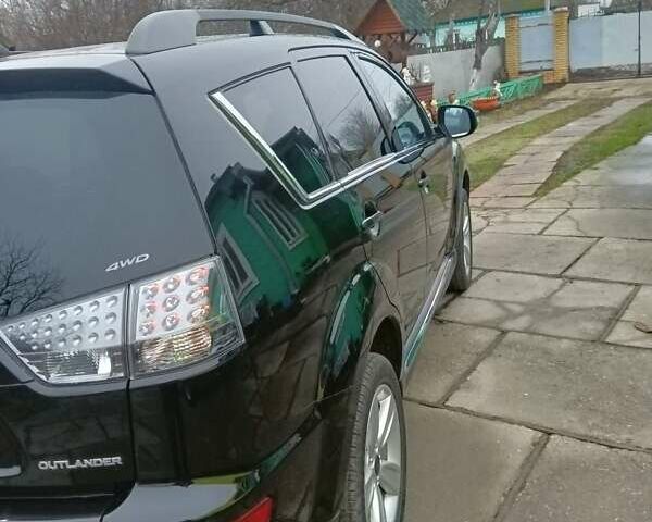 Черный Мицубиси Аутлендер, объемом двигателя 2.2 л и пробегом 218 тыс. км за 11500 $, фото 8 на Automoto.ua