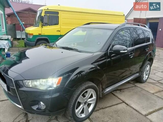Черный Мицубиси Аутлендер, объемом двигателя 2.2 л и пробегом 218 тыс. км за 11500 $, фото 4 на Automoto.ua