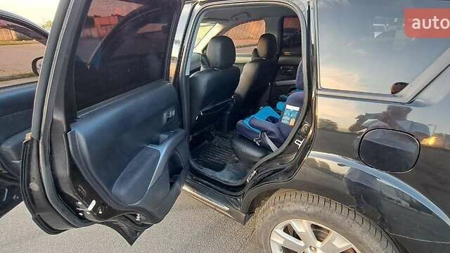 Черный Мицубиси Аутлендер, объемом двигателя 2.36 л и пробегом 285 тыс. км за 11300 $, фото 12 на Automoto.ua