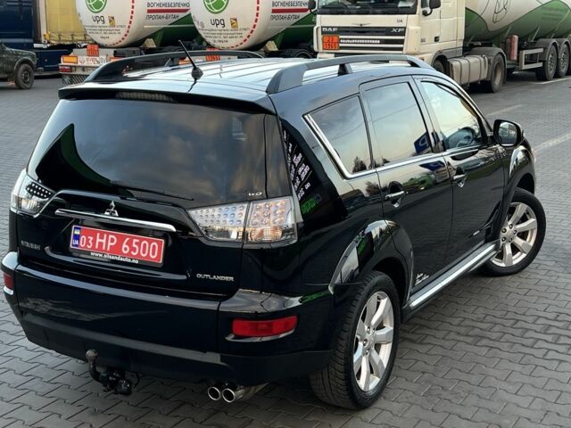 Черный Мицубиси Аутлендер, объемом двигателя 2.3 л и пробегом 124 тыс. км за 11999 $, фото 1 на Automoto.ua