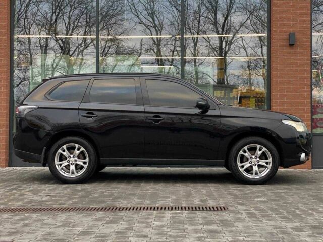 Черный Мицубиси Аутлендер, объемом двигателя 2.4 л и пробегом 212 тыс. км за 12990 $, фото 4 на Automoto.ua