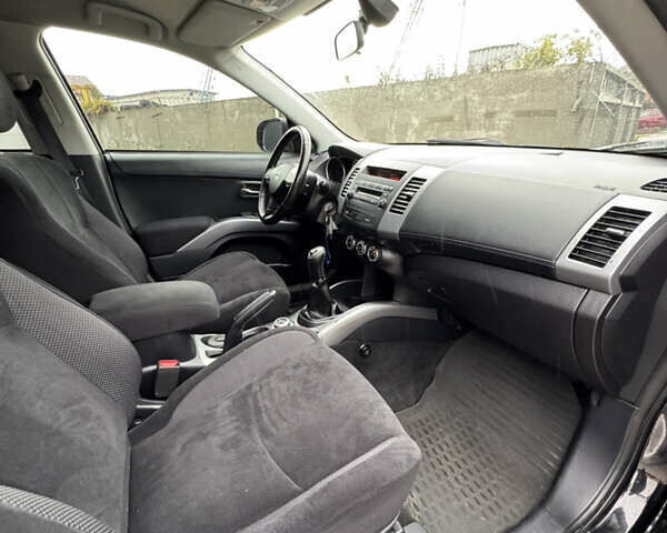 Чорний Міцубісі Аутлендер, об'ємом двигуна 2.36 л та пробігом 96 тис. км за 11700 $, фото 34 на Automoto.ua