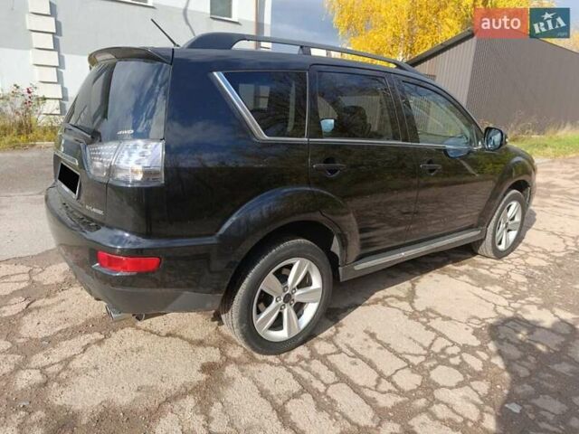 Черный Мицубиси Аутлендер, объемом двигателя 2.2 л и пробегом 218 тыс. км за 11800 $, фото 5 на Automoto.ua