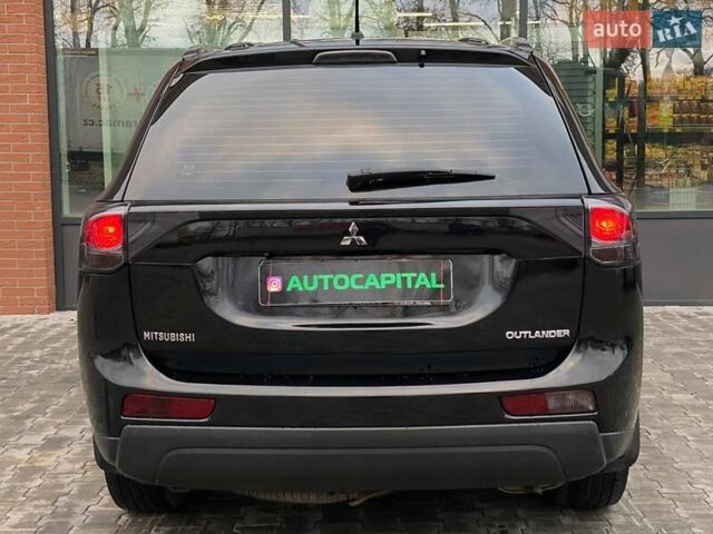 Черный Мицубиси Аутлендер, объемом двигателя 2.36 л и пробегом 212 тыс. км за 12990 $, фото 7 на Automoto.ua