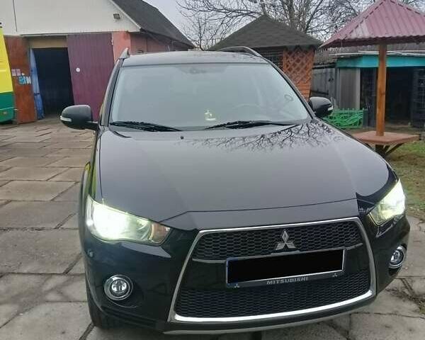 Черный Мицубиси Аутлендер, объемом двигателя 2.2 л и пробегом 218 тыс. км за 11500 $, фото 3 на Automoto.ua