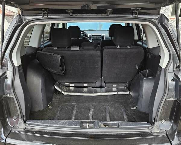 Чорний Міцубісі Аутлендер, об'ємом двигуна 2.36 л та пробігом 164 тис. км за 10800 $, фото 6 на Automoto.ua