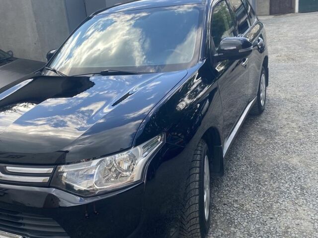 Черный Мицубиси Аутлендер, объемом двигателя 2 л и пробегом 168 тыс. км за 12007 $, фото 2 на Automoto.ua