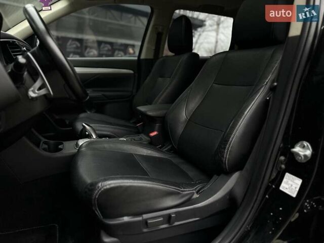 Чорний Міцубісі Аутлендер, об'ємом двигуна 2 л та пробігом 213 тис. км за 13888 $, фото 13 на Automoto.ua