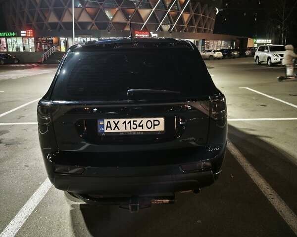 Черный Мицубиси Аутлендер, объемом двигателя 2.36 л и пробегом 226 тыс. км за 12499 $, фото 35 на Automoto.ua