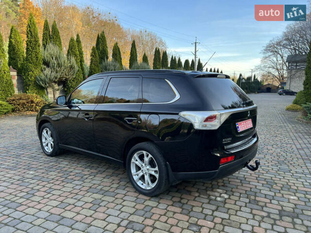 Черный Мицубиси Аутлендер, объемом двигателя 2 л и пробегом 190 тыс. км за 12500 $, фото 2 на Automoto.ua