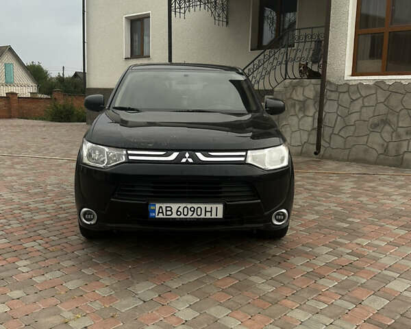 Черный Мицубиси Аутлендер, объемом двигателя 2.36 л и пробегом 70 тыс. км за 9000 $, фото 1 на Automoto.ua