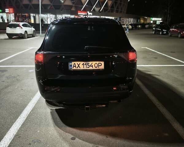 Черный Мицубиси Аутлендер, объемом двигателя 2.36 л и пробегом 226 тыс. км за 12499 $, фото 17 на Automoto.ua