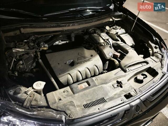 Черный Мицубиси Аутлендер, объемом двигателя 2.36 л и пробегом 226 тыс. км за 12499 $, фото 14 на Automoto.ua