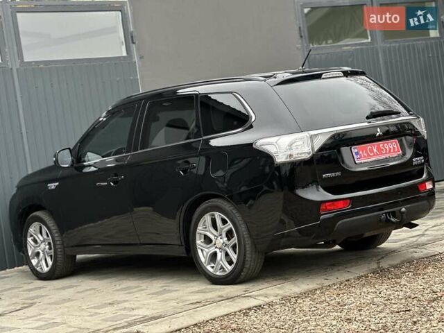 Чорний Міцубісі Аутлендер, об'ємом двигуна 2 л та пробігом 213 тис. км за 13888 $, фото 10 на Automoto.ua
