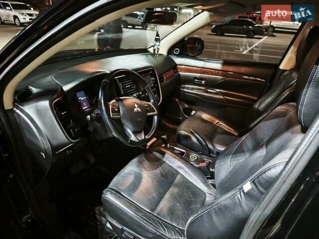 Черный Мицубиси Аутлендер, объемом двигателя 2.36 л и пробегом 226 тыс. км за 12499 $, фото 28 на Automoto.ua