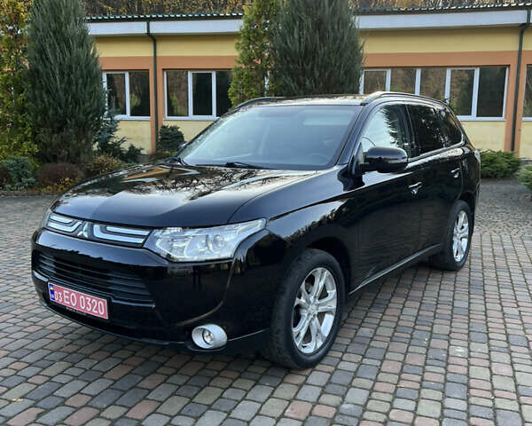 Черный Мицубиси Аутлендер, объемом двигателя 2 л и пробегом 190 тыс. км за 12500 $, фото 1 на Automoto.ua