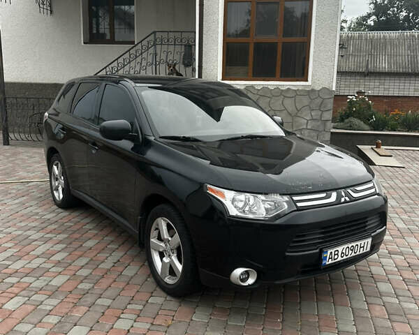 Черный Мицубиси Аутлендер, объемом двигателя 2.36 л и пробегом 70 тыс. км за 9000 $, фото 2 на Automoto.ua