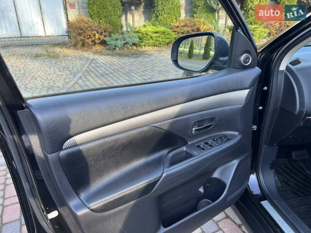 Черный Мицубиси Аутлендер, объемом двигателя 2 л и пробегом 190 тыс. км за 12500 $, фото 16 на Automoto.ua