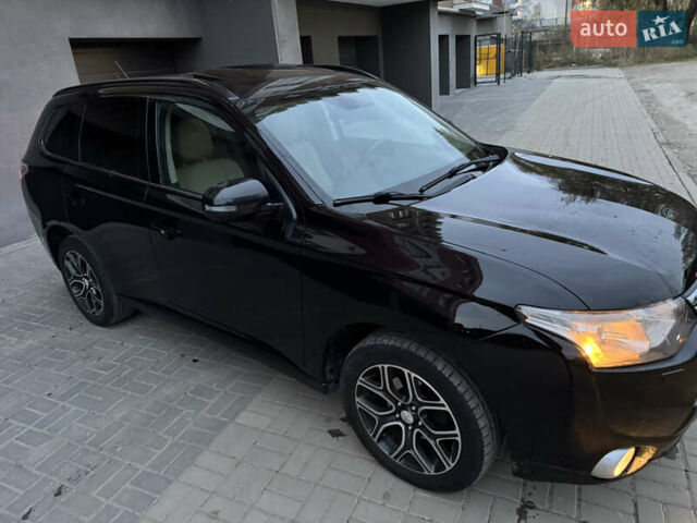 Черный Мицубиси Аутлендер, объемом двигателя 2.27 л и пробегом 241 тыс. км за 14400 $, фото 24 на Automoto.ua