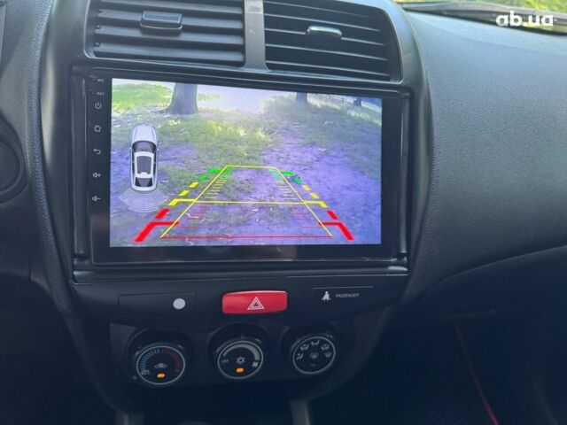 Черный Мицубиси Аутлендер, объемом двигателя 2 л и пробегом 195 тыс. км за 9990 $, фото 13 на Automoto.ua