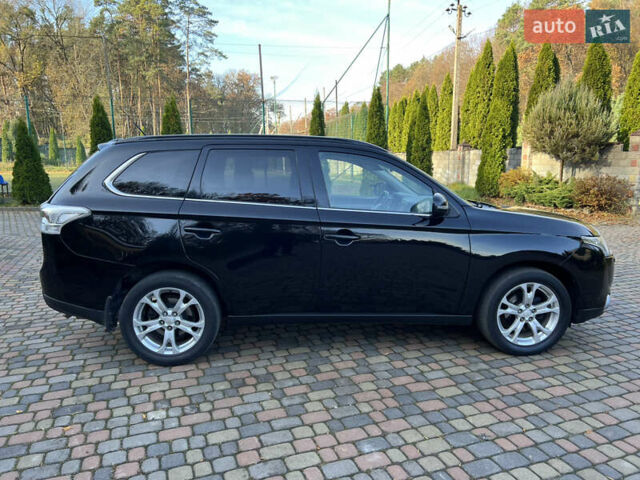 Черный Мицубиси Аутлендер, объемом двигателя 2 л и пробегом 190 тыс. км за 12500 $, фото 6 на Automoto.ua