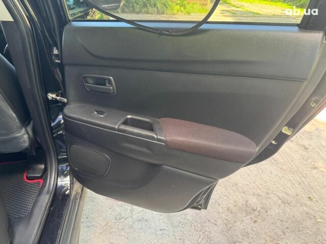 Черный Мицубиси Аутлендер, объемом двигателя 2 л и пробегом 195 тыс. км за 9990 $, фото 18 на Automoto.ua