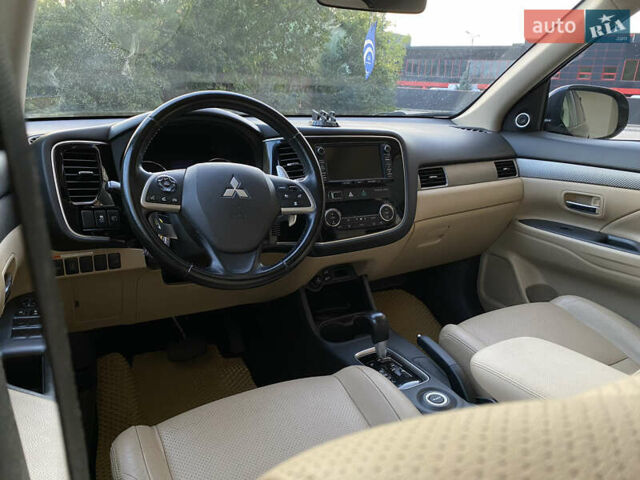 Черный Мицубиси Аутлендер, объемом двигателя 2.27 л и пробегом 241 тыс. км за 14400 $, фото 52 на Automoto.ua