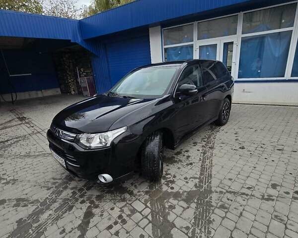 Черный Мицубиси Аутлендер, объемом двигателя 2 л и пробегом 140 тыс. км за 11300 $, фото 3 на Automoto.ua